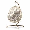 Hängesessel aus Stahl und Rattan mit Polyesterkissen, Beige